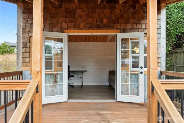 Double doors lead from this covered porch to the 160 sf