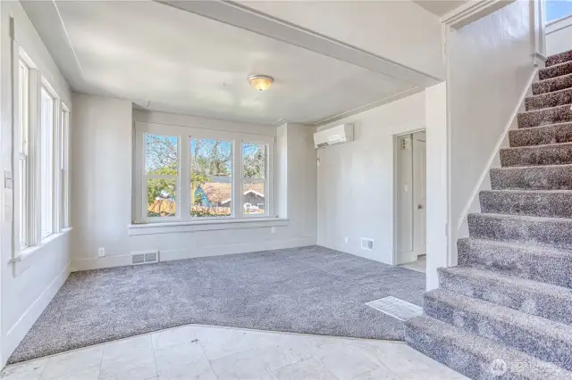 Looking toward living room with large windows