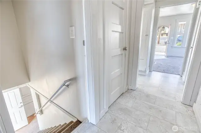 Main level hallway with stairs going down