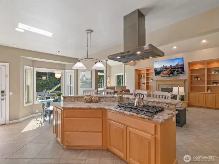 The kitchen features a new stainless steel hood and cooktop, and the home is equipped with AC units throughout for year-round comfort.