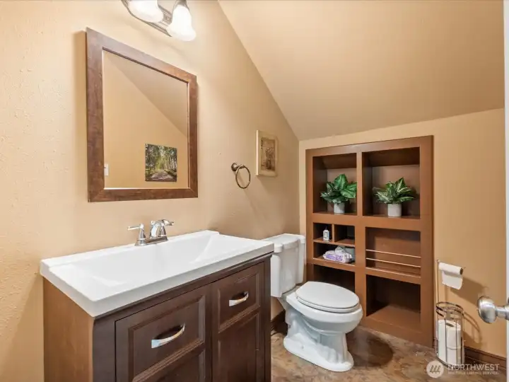 A convenient half bath adjacent to the bonus room allows easy access without having to go downstairs.