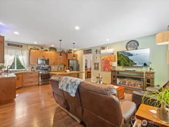 The ADU features a full kitchen with standard-size appliances, a comfortable living room, and mini-split AC/heat units for year-round comfort.