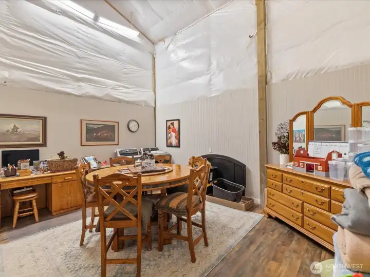Located at the back of the RV bay, this space can easily be converted back to its original use or left as a dining area. The washer and dryer are conveniently tucked into the back corner.