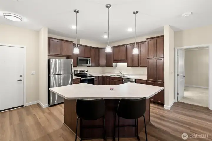 Kitchen to left of entry door