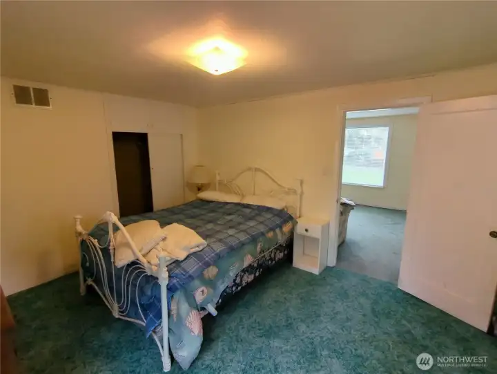 Main floor bedroom located off the living room.