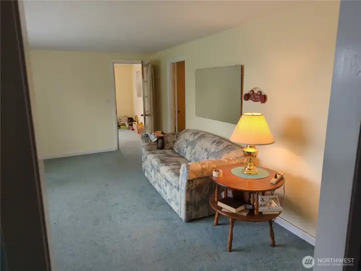 Another view of the living room looking toward the front entry.