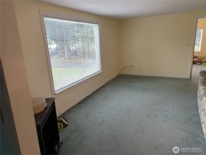 Living room with a large picture window.