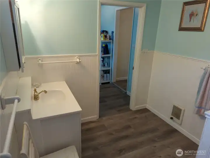 Another view of the bathroom off the laundry room.