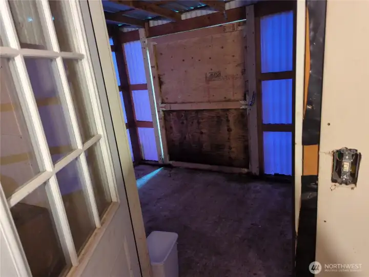 A garden shed/ work area on the back of the garage.