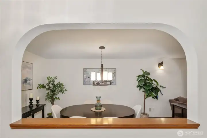 View from the entry hall through the archway into the dining room.