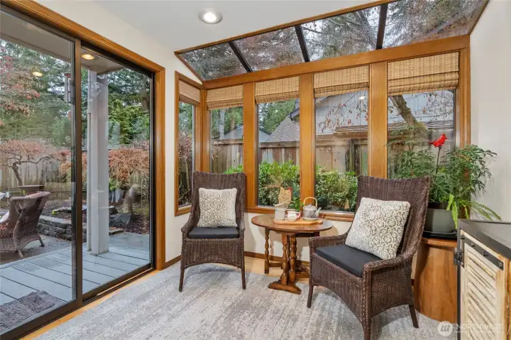 Sunroom/eating nook off the kitchen with slider leading to back deck and yard.