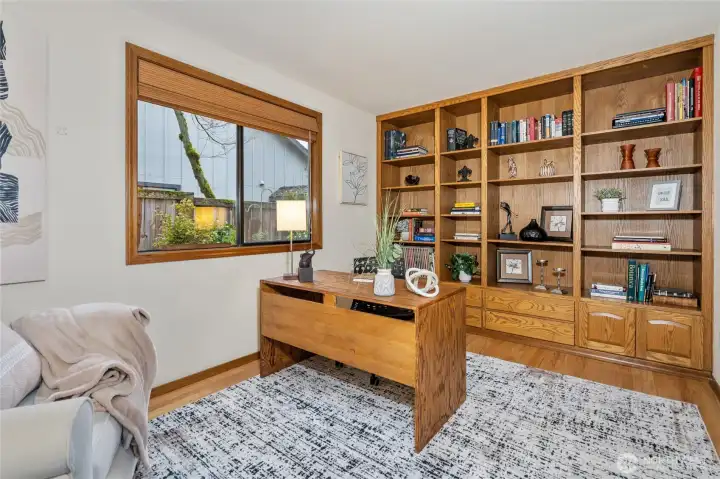 Another view of the main floor den, showing the built-in book shelves.