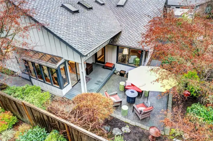 Drone view of the rear yard, patio and deck.