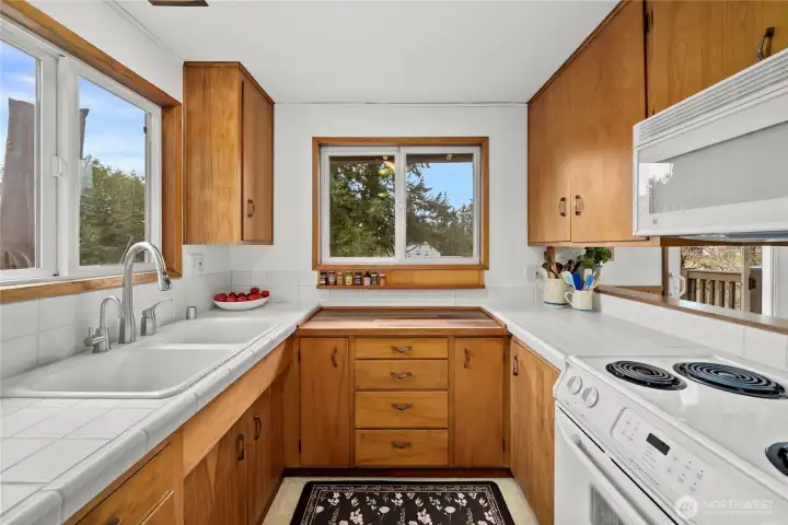 Great prep area with handy shelf for spices.