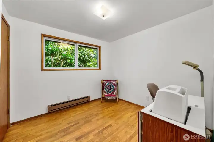 Bedroom #2. Large pink camellia tree just outside the window.