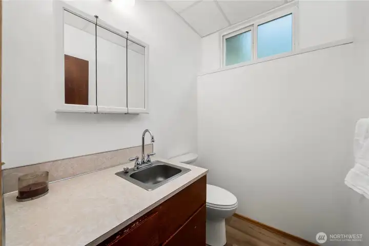 Half bathroom. At some point, the bathroom and laundry could be combined and add in a shower. Lot's of potential.