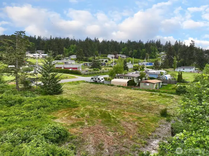 Looking Northeast toward the next door neighbor and an overview of the plat.