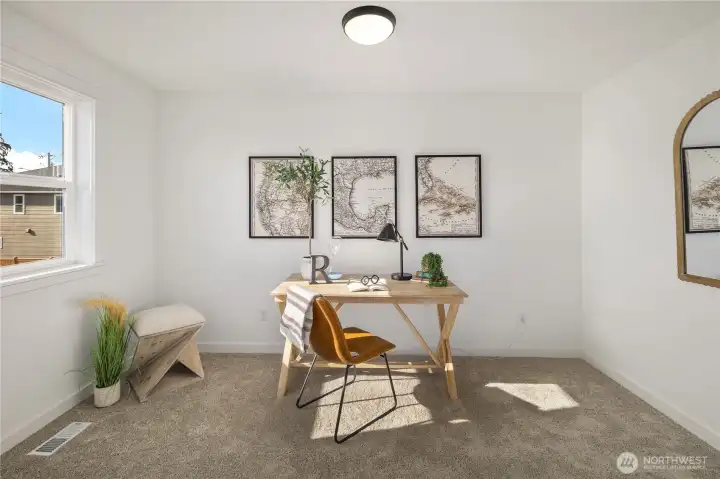 Primary Suite Sitting Room  Connected to the primary suite, this flexible sitting room offers a quiet extension of the retreat. A large window brings in natural light, while soft carpeting and clean lines create a comfortable setting for a home office, reading nook, or private lounge. The thoughtful separation from main living areas enhances privacy and function.    Set in Bothell’s Canyon Park neighborhood, this adaptable space reflects the intentional design found in high-end Pacific Northwest contemporary homes. The added versatility supports modern lifestyles within a thoughtfully designed new construction residence located in the Northshore School District.    These photos are from a past Robinson Plan at a different community, so overall plan, colors, building orientation, finishes, home outlook, and other details can and WILL vary. All photos, renderings, site maps, and floorplans are for visualization purposes only.