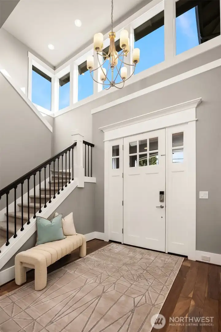 Step into a soaring 2-story foyer with bright clerestory windows.