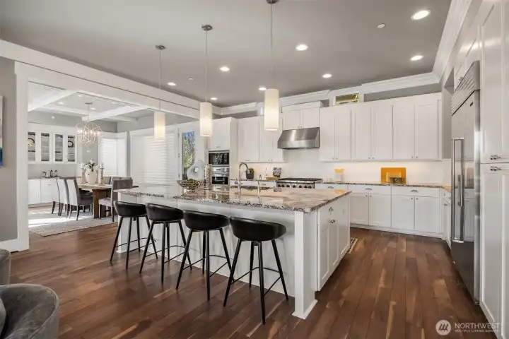 Grand kitchen with a social, open layout and plenty of bar seating.