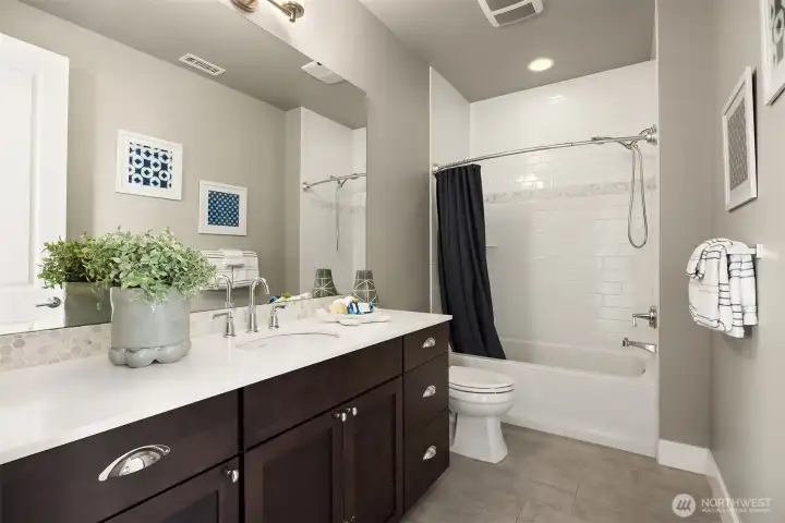Full en-suite bath in the first bedroom.