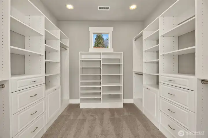 The dreamy walk-in closet has room for all of your favorite things, along with natural light to help you choose what to wear.