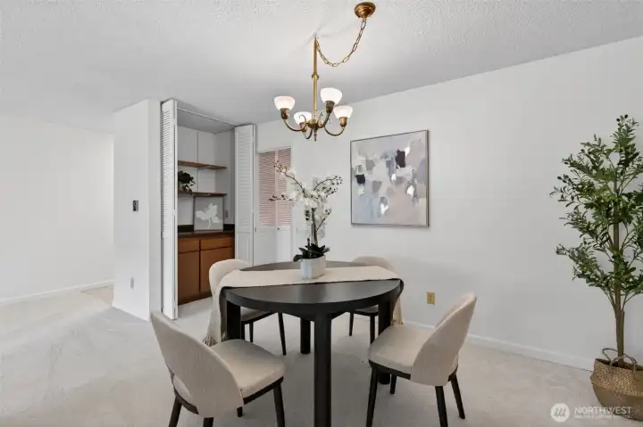 The dining space in the living room with a nice little cabinet you store your expensive plates. Is that still a thing? The dining space in the living room with a nice little cabinet you store your expensive plates. Is that still a thing?