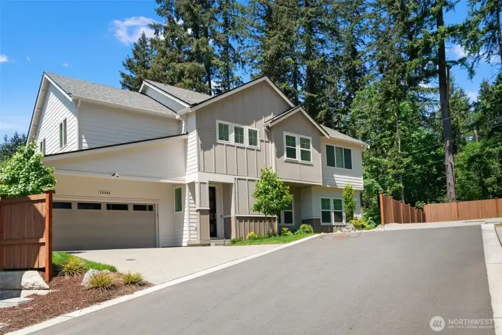 This modern craftsman home turns heads from the moment you arrive, showcasing a clean board-and-batten facade, fresh landscaping, and a beautifully fenced yard. The attached 2-car garage and welcoming entryway make coming home feel effortless every single day