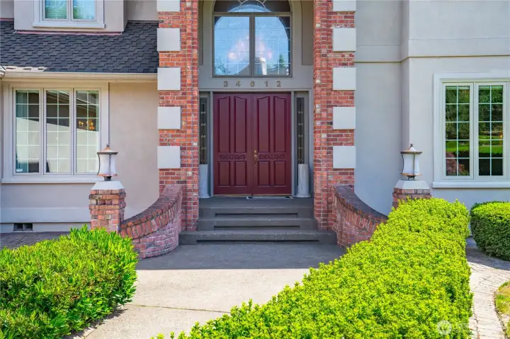 Tall, stately double doors on this covered porch Tall, stately double doors on this covered porch