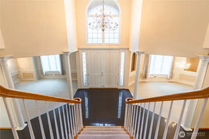 Formal entry hall is absolutely gorgeous with lofted ceilings and columns for open rooms. Formal living room on the left, formal dining room on the right. Formal entry hall is absolutely gorgeous with lofted ceilings and columns for open rooms. Formal living room on the left, formal dining room on the right.
