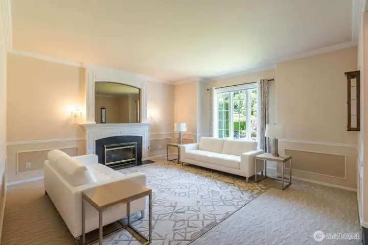 Formal living room with its own cozy gas fireplace. Formal living room with its own cozy gas fireplace.