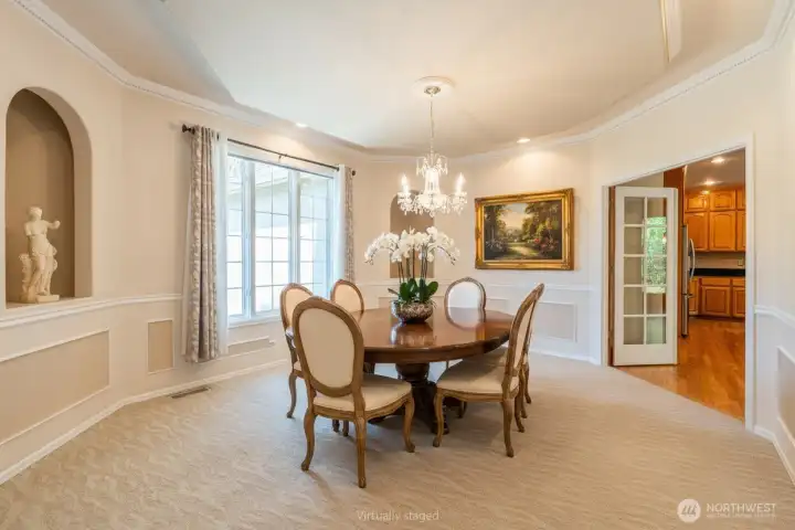 Formal dining room with French doors to kitchen. Nice size space for a large table. Formal dining room with French doors to kitchen. Nice size space for a large table.