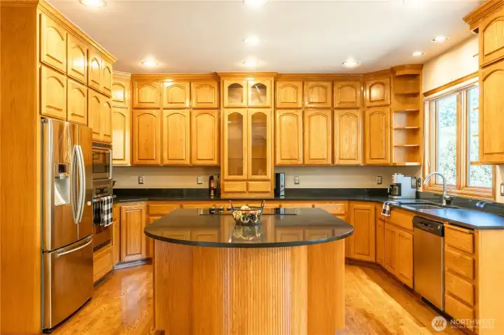 This amazing kitchen has so many cabinets and storage options! Built in china cabinet. There is a gas range in the garage that can come with the home and be re-installed in the kitchen. The island has room for 4 stools. This amazing kitchen has so many cabinets and storage options! Built in china cabinet. There is a gas range in the garage that can come with the home and be re-installed in the kitchen. The island has room for 4 stools.
