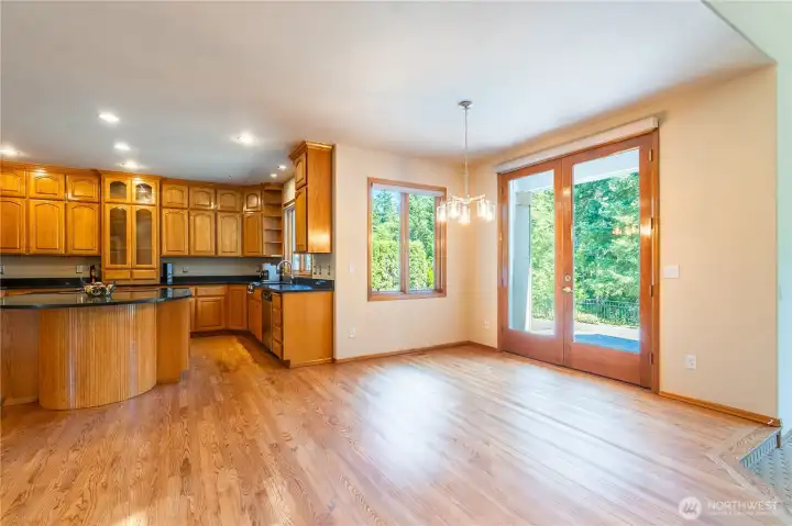 Kitchen also has room for another table for more casual dining. The double doors lead to the patio. Kitchen also has room for another table for more casual dining. The double doors lead to the patio.