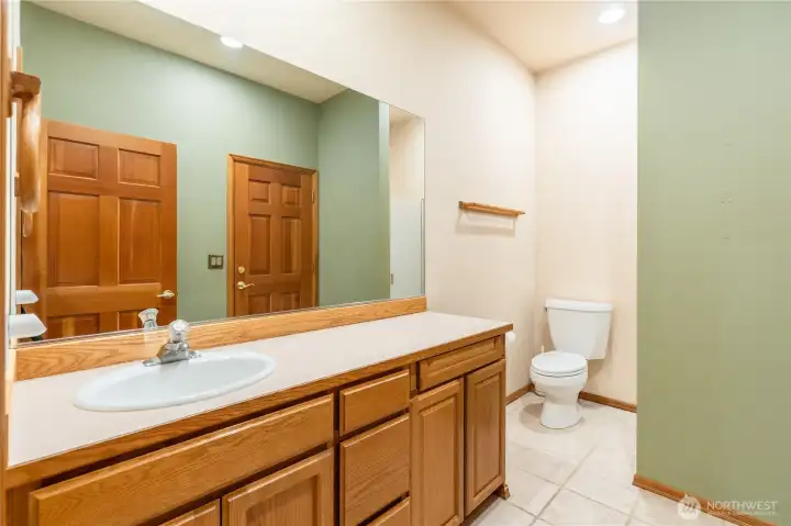 This 3/4 quarter bath w/shower sits off the laundry room and the shop, with a door to each. Clean up from your messy shop projects without dragging dirt and grime into the home. This 3/4 quarter bath w/shower sits off the laundry room and the shop, with a door to each. Clean up from your messy shop projects without dragging dirt and grime into the home.