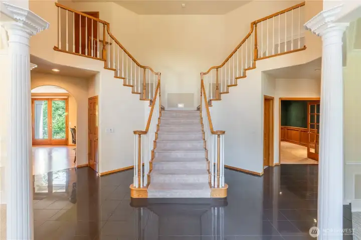 Double staircase leads to primary suite on the right, and the other bedrooms and bonus room on the left. The closet doors on the left and right connect under the stairs for a fantastic storage area. Double staircase leads to primary suite on the right, and the other bedrooms and bonus room on the left. The closet doors on the left and right connect under the stairs for a fantastic storage area.