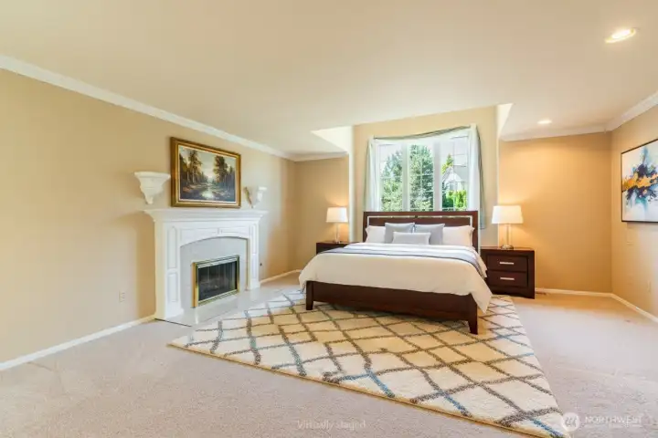 Primary suite is quite large, with plenty of room for seating areas. A nice gas fireplace for chilly winter evenings (or gray mornings). Primary suite is quite large, with plenty of room for seating areas. A nice gas fireplace for chilly winter evenings (or gray mornings).