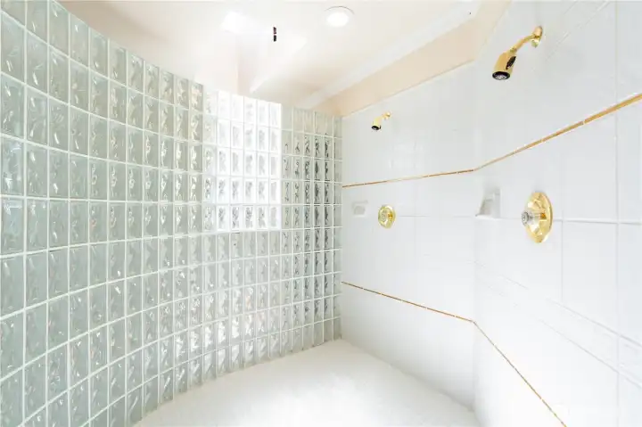 The shower has double shower heads for conserving water. The shower has double shower heads for conserving water.