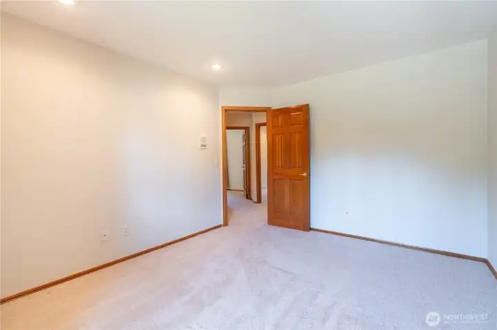 Large bedroom with walk-in closet. Large bedroom with walk-in closet.