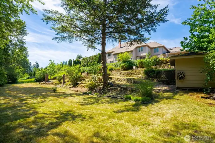 This park-like backyard is private with mature landscaping and trees. There's plenty of room for your toys and the shed helps you store them! This park-like backyard is private with mature landscaping and trees. There's plenty of room for your toys and the shed helps you store them!