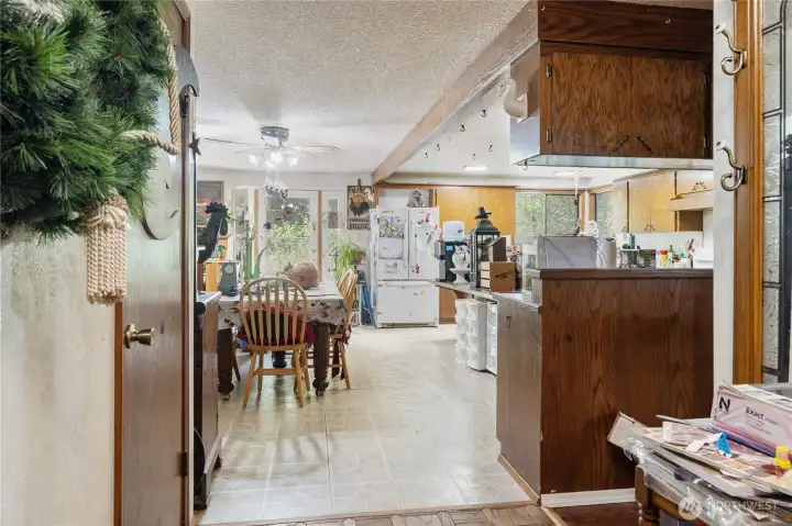 Entry. Wood parquet floors greet you. Den to the left, great room to the right, kitchen and dining straight ahead. All one floor living space.