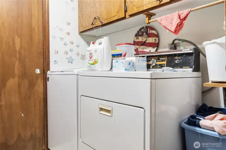 Laundry room and half bath leads to a bonus room and the hallway to the dining.