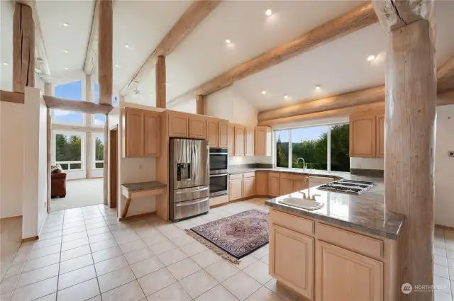 Gourmet kitchen with double oven, second sink, stainless appliances and tons of counter space and cabinets.