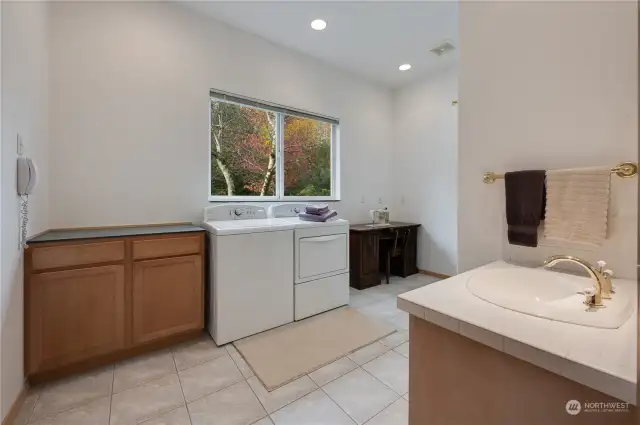 Laundry room with extra counter space, 3/4 bath.