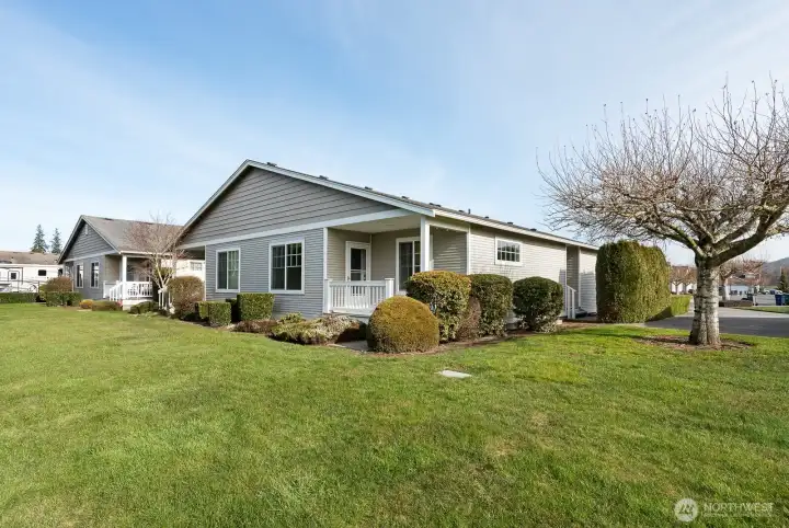 Beautifully landscaped backyard, so much privacy! Paved driveway and walkway to front door.