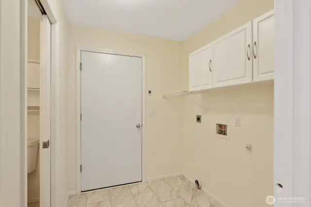 Laundry Room with extra storage and access to garage.