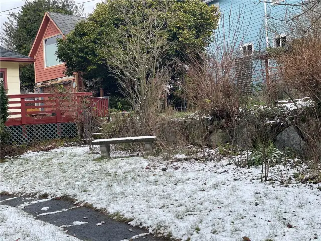 Rockery in front yard helps define the property line.