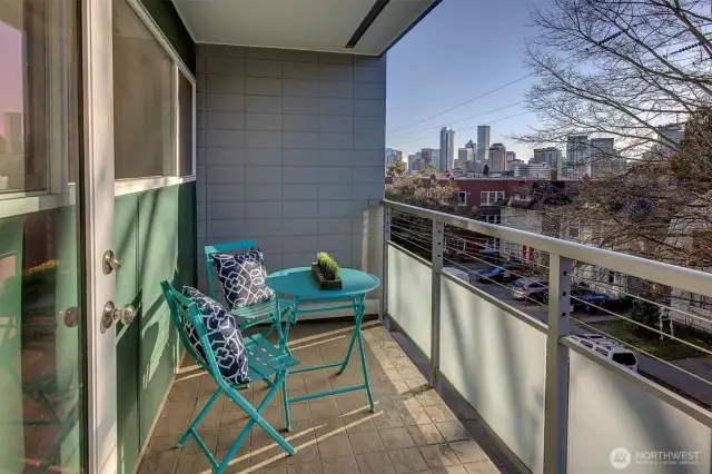 Take in the warm spring days and city vibe from your covered veranda.
