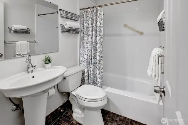 Light and bright full bathroom off the bedroom.