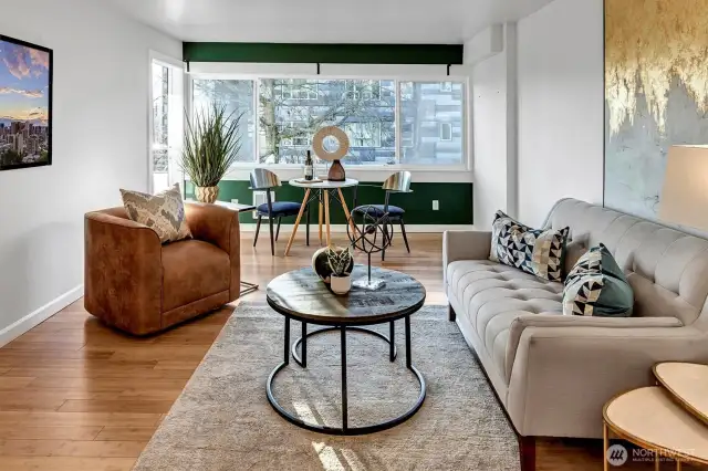 Western facing third floor unit with bamboo floors, granite counters and covered deck off the living/dining